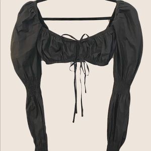 Gorgeous black long sleeve crop top. The sleeves are beautiful and unique.